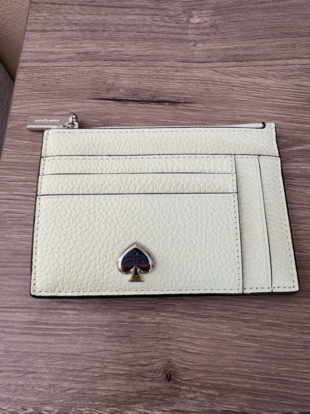 kate spade pale mint pebbled leather card wallet with spade emblem